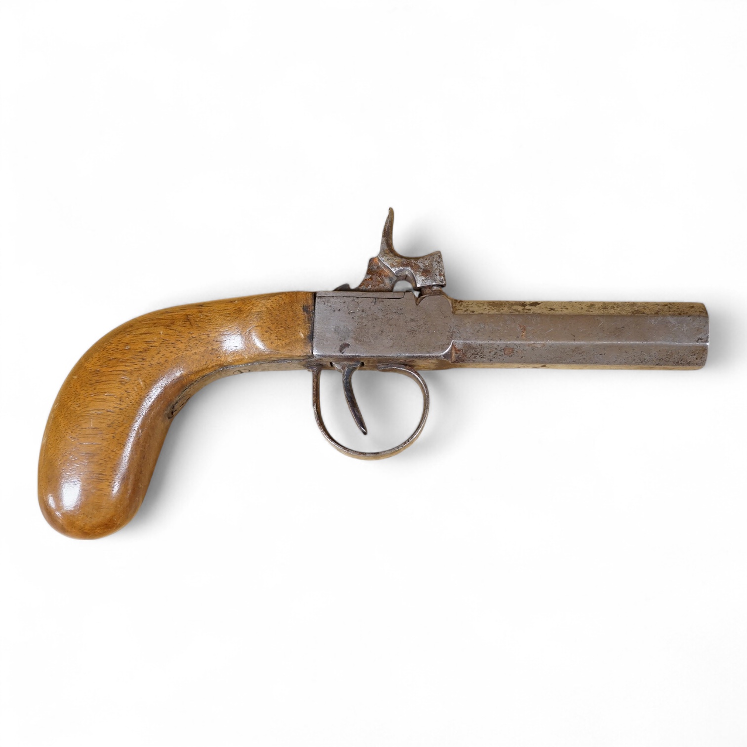A Belgian boxlock percussion pocket pistol with octagonal barrel, hammer offset for sighting, and rounded wooden butt